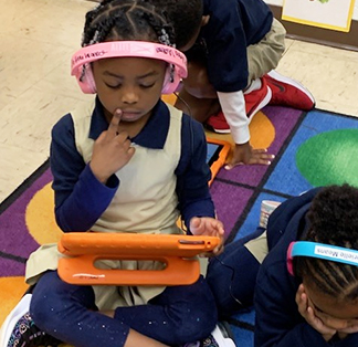 Elementary school girl learning on a tablet