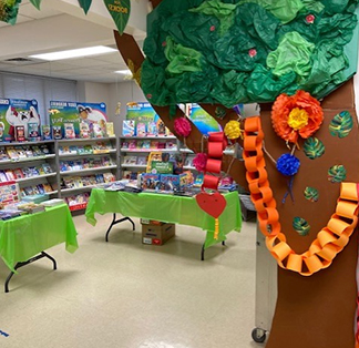 School library decorated with colorful books and tree