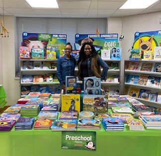 Two parents in front of book fair